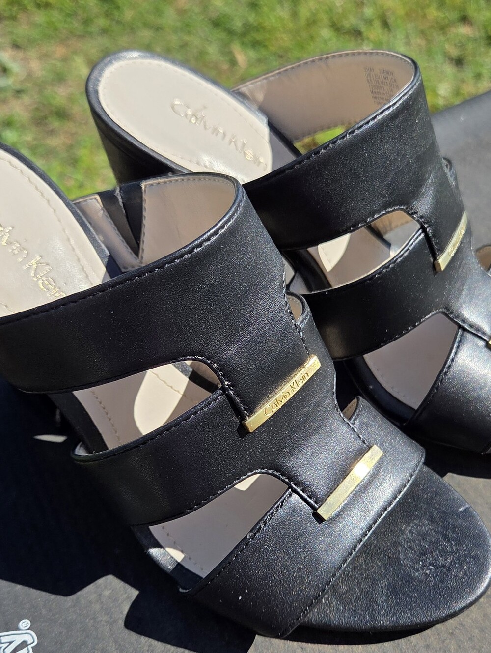 Calvin Klein Black Leather Slide Mules with Gold Accents
